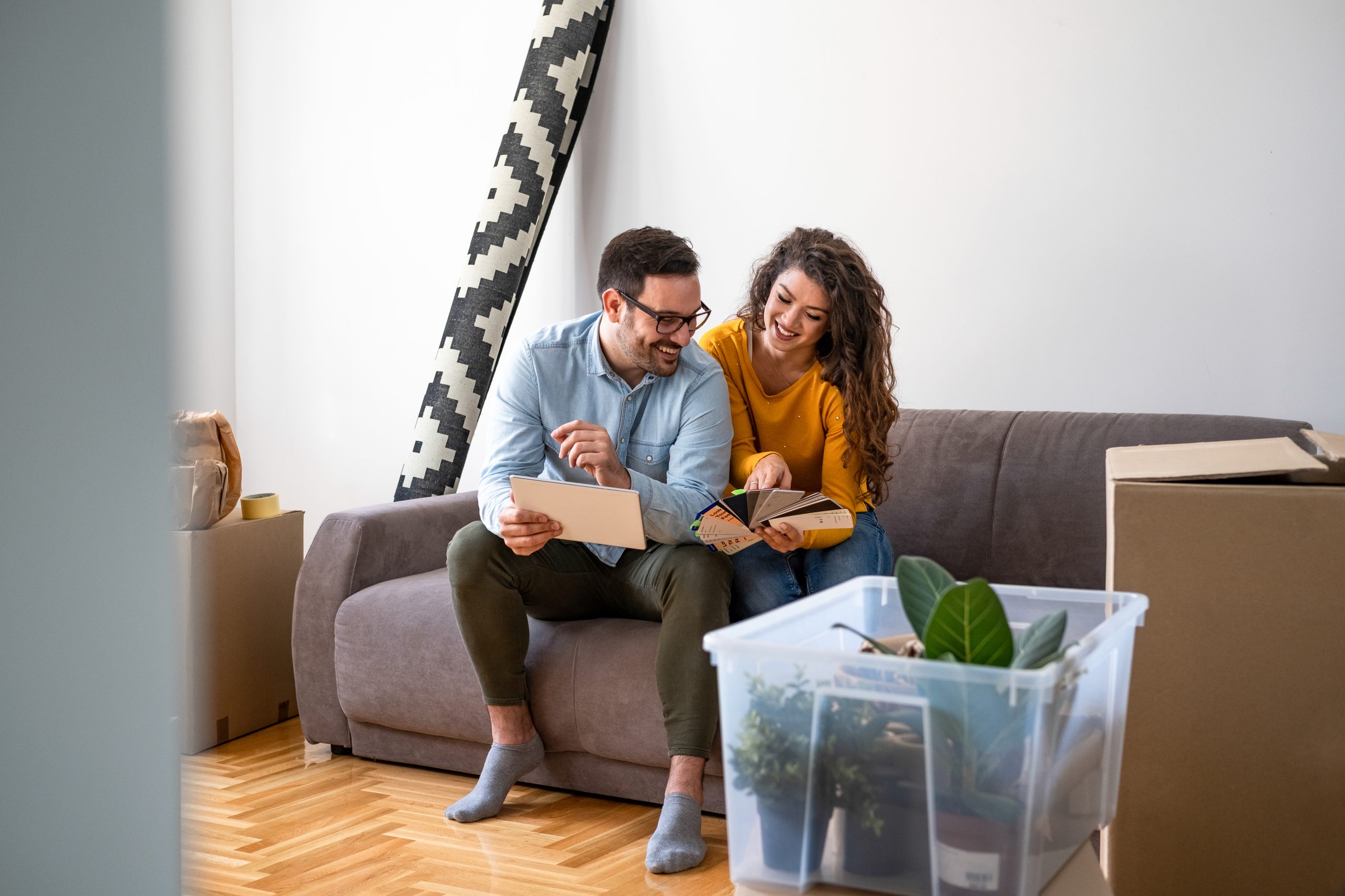 Smiling couple sitting on the sofa