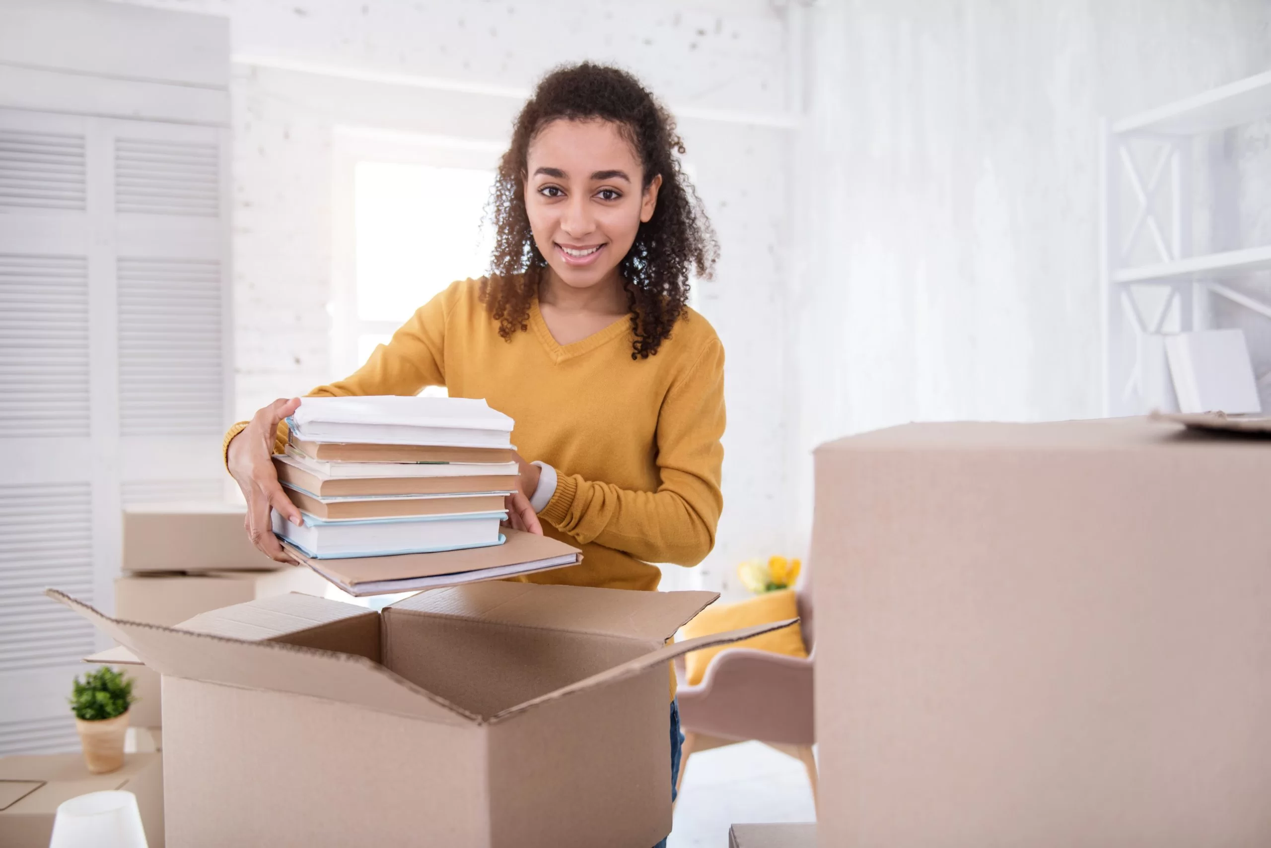 curly haired girl with books